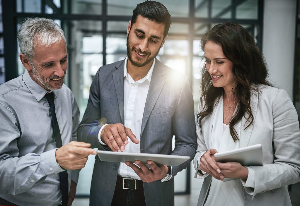 Planning discussion between three business people