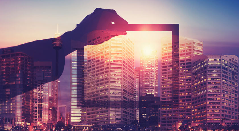 Brightly lit cityscape with a picture frame silhouette