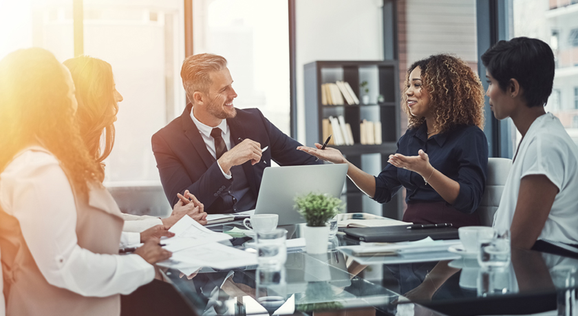 Business meeting with five coworkers at a conference table
