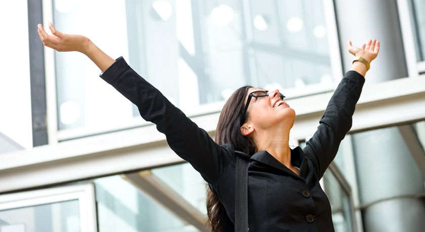 Businesswoman with arms outstretched