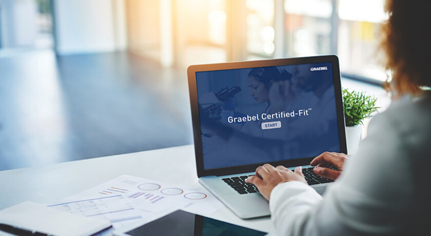 Woman On Laptop With Graebel Certified Fit on Screen